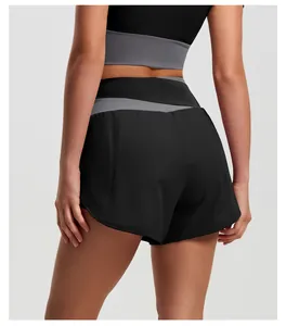 Back view of black high-waisted yoga shorts with gray color-block waistband