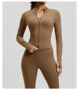 Front view detail of a slim-fit brown yoga zip-up jacket with functional stand-up collar
