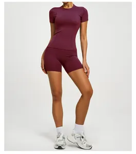 Professional burgundy women's yoga set with slim fit short sleeve top and shorts