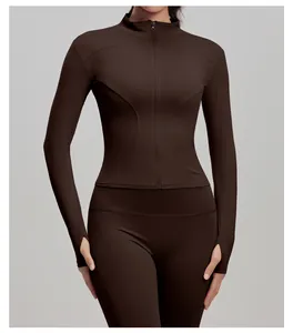 Detailed view of brown slim-fit yoga jacket with front zipper and thumb holes