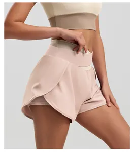 Close-up detail of high waist contrast color yoga shorts with double layer design.