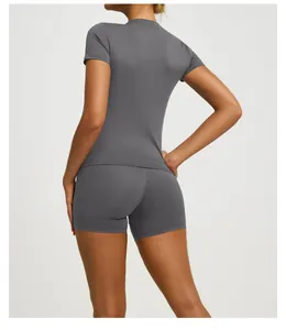 Back view of a grey short-sleeved yoga top and matching athletic shorts fitness set