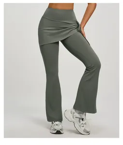 Detail view of high-waisted flared yoga pants featuring a ruched fake two-piece overlay design