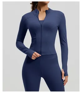 Close-up detail of slim fit navy blue long sleeve yoga jacket with thumb holes and zipper