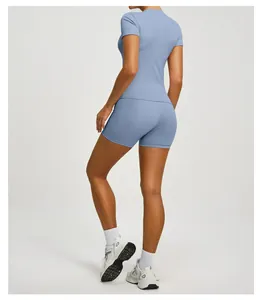 Back view of slim fit yoga set with blue short sleeve top and high waist biker shorts.