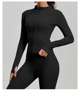 Close-up detail of black slim-fit yoga jacket with front zipper and thumb hole sleeves