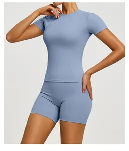 Close-up of a slim fit blue yoga set with short sleeve top and cycling shorts for gym