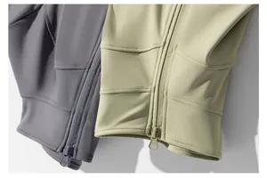 Detail of yoga jacket zippers and high-quality fabric texture in grey and sage green