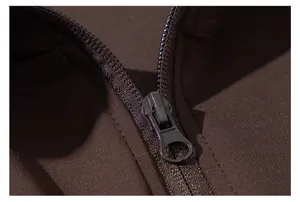 Detailed macro view showing smooth zipper and stitching on dark brown slim fit yoga jacket