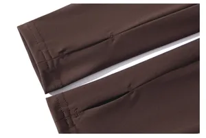 Close-up detail of dark brown athletic sleeve with functional thumbhole design