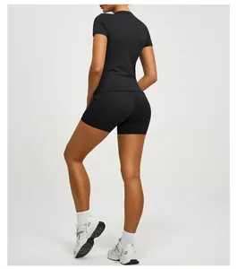 Detailed back view of a slim-fit black women's yoga top and athletic bike shorts set
