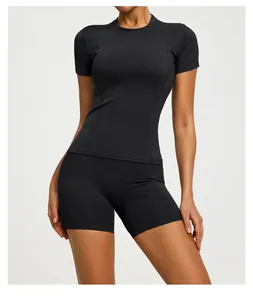 Close-up of black slim fit short sleeve yoga top and matching biker shorts