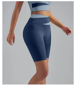 Detailed view of high-waisted blue yoga biker shorts with peach lift design for women fitness