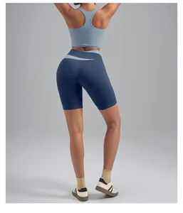 Detailed back view of high-waisted blue yoga shorts with peach hip lifting effect