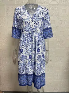 Elegant blue and white floral print V-neck maxi dress with a loose fit and button detail