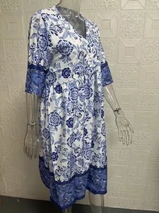 Detailed side view of elegant blue and white V-neck floral print loose maxi dress for women