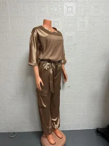 Side view of women's bronze satin two-piece set with half-sleeves on a mannequin