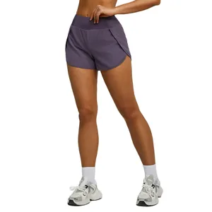 High waisted purple women's double layer athletic running shorts with side pockets and inner liner
