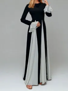 Elegant black and white color-block maxi dress with ruffled long sleeves and high waist design