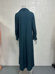 Back view of a casual loose dark teal long-sleeved maxi dress displayed on a mannequin