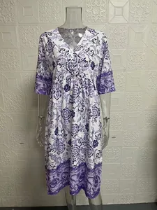 Detailed view of women's elegant V-neck floral maxi dress with loose fit design