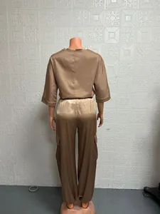 Detailed back view of a champagne satin two-piece set featuring five-quarter sleeves
