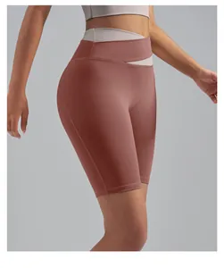 Detail view of high waist yoga shorts with crossover waistband and peach lift effect