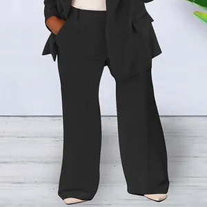 Detailed view of women's professional black slim fit blazer and wide-leg suit trousers set