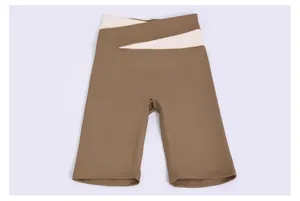 Detailed view of olive green high-waisted yoga shorts with white crossover waistband design