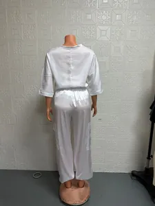 Full back view of women's white satin two-piece set with short sleeve top and cargo pants