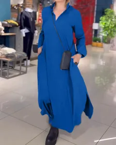Close-up detail of a loose V-neck solid blue long sleeve maxi dress for autumn wear