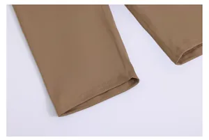 Close-up of brown high-waist yoga shorts showing durable hem stitching