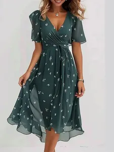 Elegant V-neck floral print dress in dark green with flattering waist tie for women.