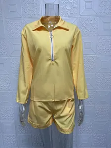 Bright yellow long sleeve half-zip top and matching shorts two-piece clothing set for women