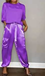 Elegant purple satin two-piece set featuring short sleeve top and cargo style pants on model