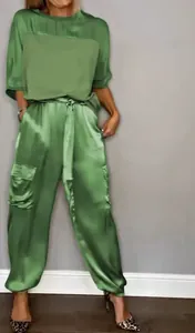 Chic olive green satin two-piece set featuring a short-sleeved top and cargo pants.
