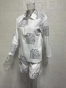 Elegant women's two-piece clothing set with long-sleeve zipper top and print shorts