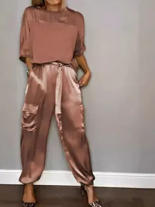 Chic women's dusty rose satin two-piece set with half-sleeve top and cargo pants