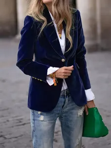 Detail of elegant navy blue velvet slim fit blazer with textured finish and gold buttons