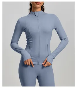 Close-up detail of a blue stand collar sports yoga jacket with zip closure and thumbholes