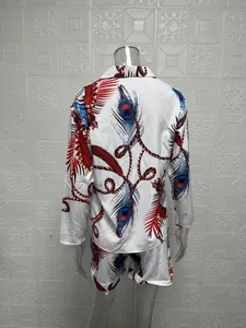 Back view of women's two-piece set with peacock feather and leaf print pattern