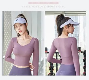 Close-up detail of a purple long sleeve cropped yoga top with built-in pads for gym workouts