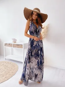 Detailed view of women's tropical leaf print sleeveless V-neck maxi dress with straw hat