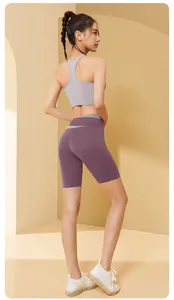 Back view of seamless yoga set with grey sports bra and purple high-waist shorts