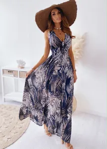 Full length view of a navy blue palm print sleeveless maxi dress with a V-neckline