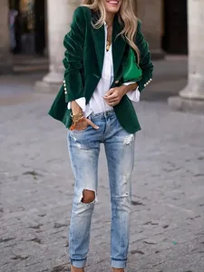 Elegant emerald green velvet blazer jacket for women styled with casual ripped jeans and shirt