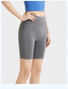 High-waisted gray yoga shorts with side ribbed pockets for women's fitness training