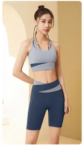 Front view of color-block sports bra and high-waisted fitness shorts