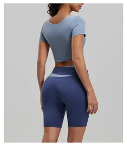 Detail view showing the back fit of color-blocking yoga short sleeve and shorts set.