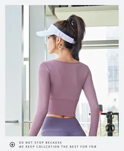 Back view of a tight-fit cropped long-sleeve purple yoga top designed for gym and fitness